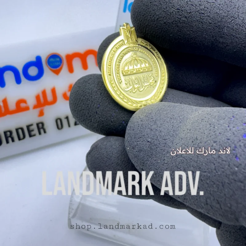 A suit pin with the logo of the Egyptian House of Representatives